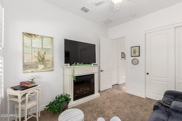 2879 E Austin Dr, Gilbert, AZ 85296 - living room with carpet, ceiling fan, a fireplace, and baseboards