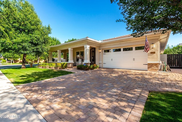 2879 E Austin Dr, Gilbert, AZ 85296 - view of front of property featuring stucco siding, a garage, a porch, and decorative driveway