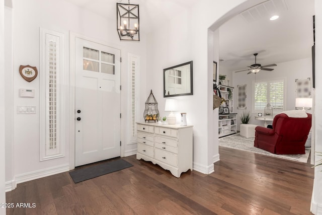 2879 E Austin Dr, Gilbert, AZ 85296 - entrance foyer featuring arched walkways, dark wood-style flooring, ceiling fan, baseboards, and recessed lighting