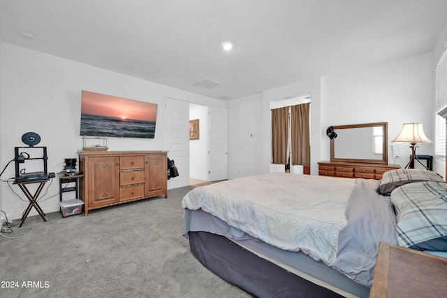 bedroom with light colored carpet