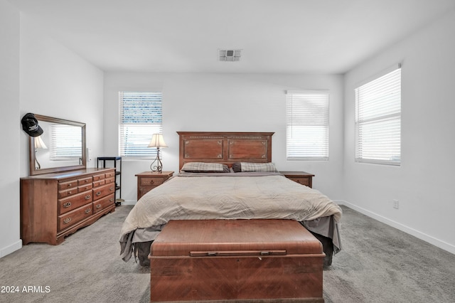 bedroom with light colored carpet