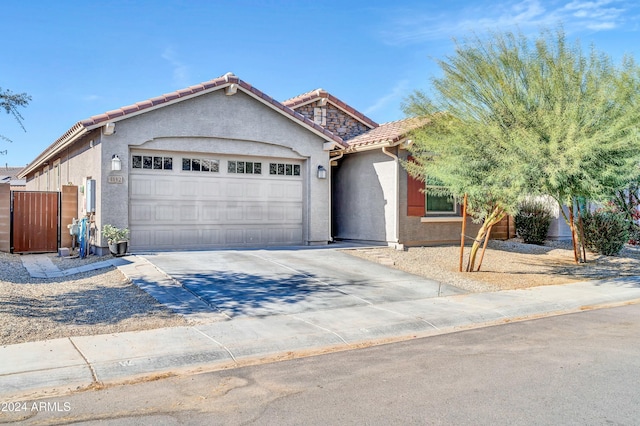 ranch-style house featuring a garage