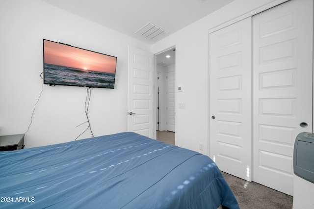 carpeted bedroom with a closet