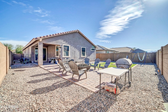 rear view of house featuring a patio