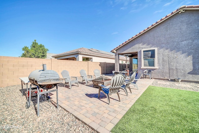 view of patio / terrace featuring a fire pit and a grill