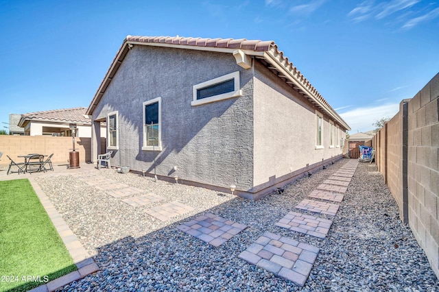 back of property with a patio area