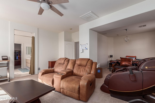 carpeted living room with ceiling fan