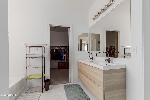 bathroom with vanity and a tub to relax in