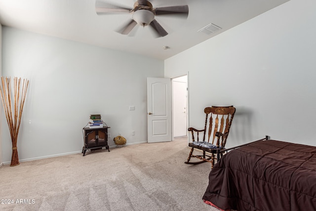 bedroom featuring light carpet and ceiling fan