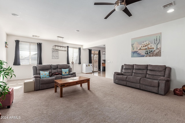 living room featuring carpet flooring and ceiling fan