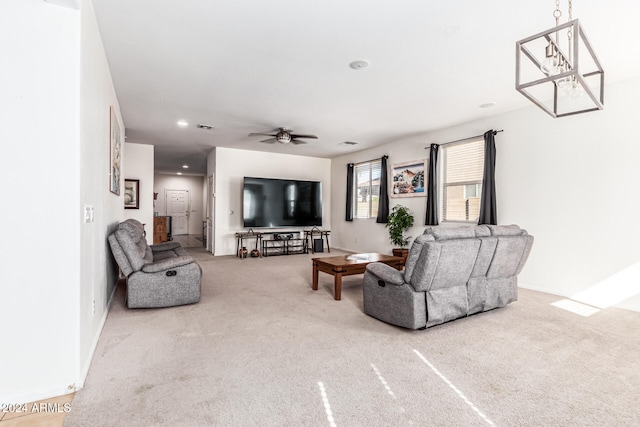 living room with carpet floors and ceiling fan