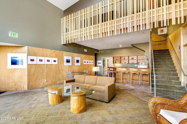 1185 W University Ave Unit 228, Flagstaff, AZ 86001 - living area with a high ceiling and stairs
