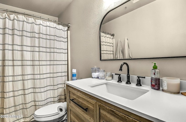 1185 W University Ave Unit 228, Flagstaff, AZ 86001 - full bathroom featuring vanity, a textured wall, and a shower with shower curtain