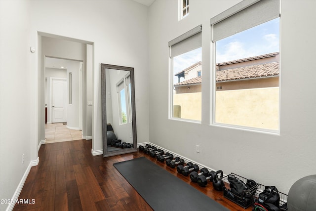 8240 E Wingspan Way, Scottsdale, AZ 85255 - exercise room featuring plenty of natural light, wood finished floors, and baseboards