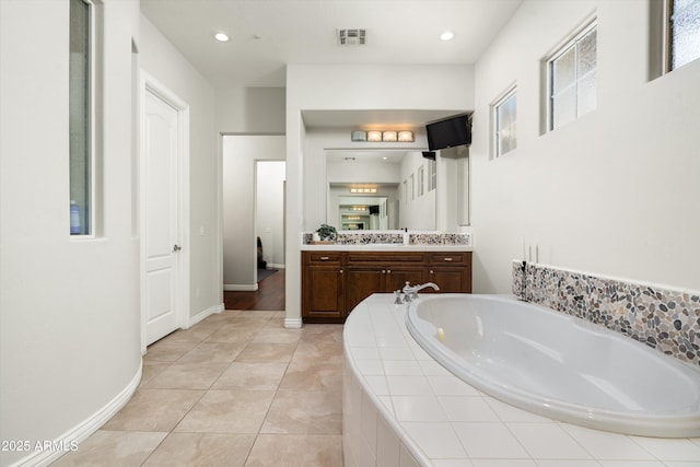 8240 E Wingspan Way, Scottsdale, AZ 85255 - bathroom featuring vanity, a bath, baseboards, tile patterned flooring, and recessed lighting