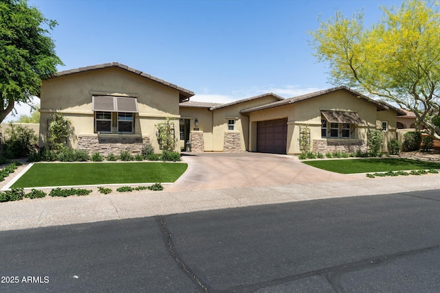8240 E Wingspan Way, Scottsdale, AZ 85255 - view of front of house featuring stone siding, a garage, stucco siding, and concrete driveway