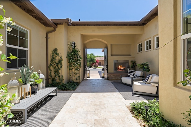 8240 E Wingspan Way, Scottsdale, AZ 85255 - view of patio with a warm lit fireplace