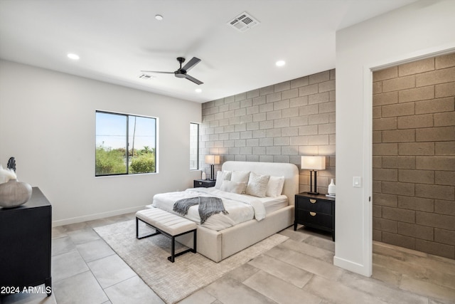 bedroom with ceiling fan and light tile patterned flooring