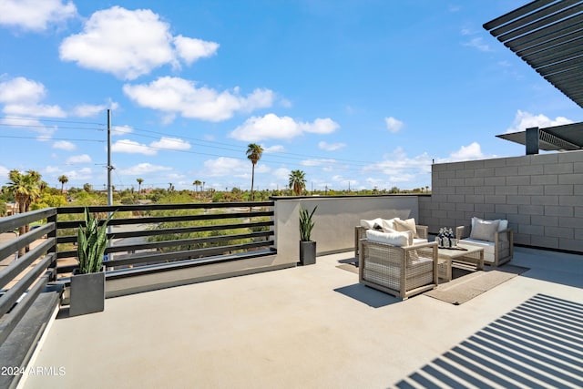 view of patio with a balcony and outdoor lounge area