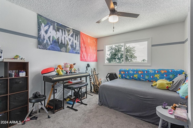 bedroom featuring ceiling fan, carpet, and a textured ceiling