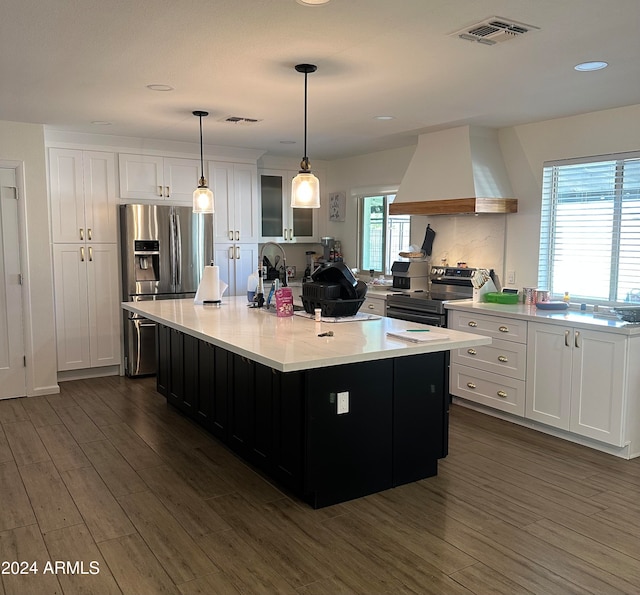 kitchen featuring white cabinets, custom range hood, and dark hardwood / wood-style floors