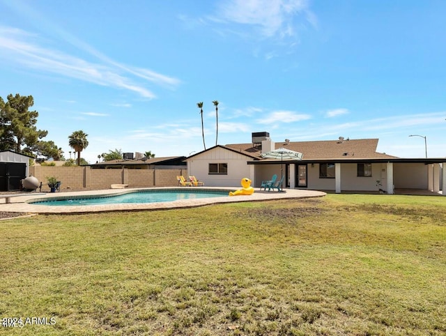 exterior space featuring a patio area and a lawn