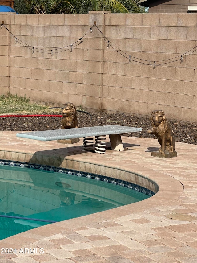 exterior details with a pool