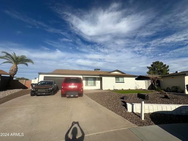 ranch-style house featuring a garage