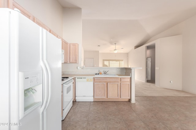 kitchen featuring vaulted ceiling, kitchen peninsula, sink, ceiling fan, and white appliances