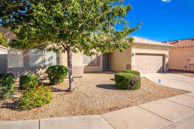 obstructed view of property featuring a garage