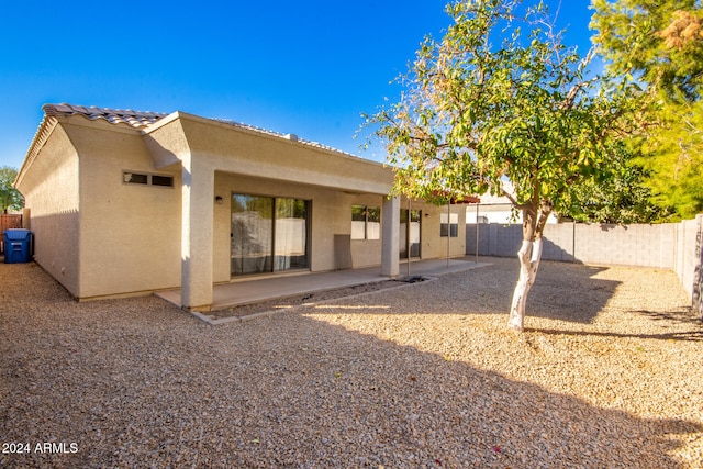 back of property featuring a patio