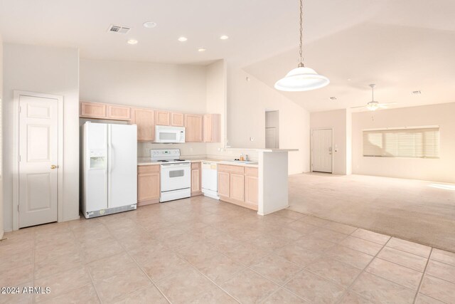 kitchen featuring light colored carpet, kitchen peninsula, hanging light fixtures, light brown cabinets, and white appliances