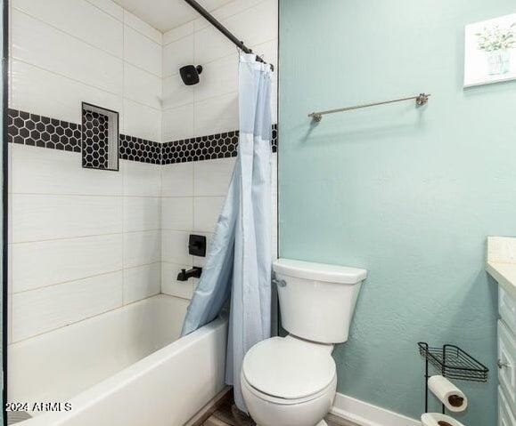 full bathroom featuring vanity, toilet, and shower / bath combo with shower curtain