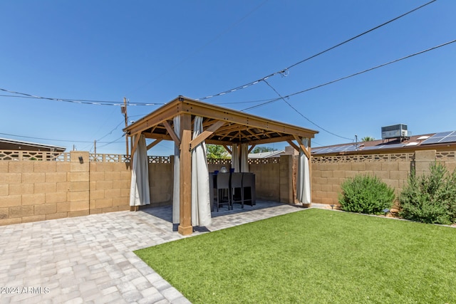 view of yard with a gazebo, a patio area, and central AC