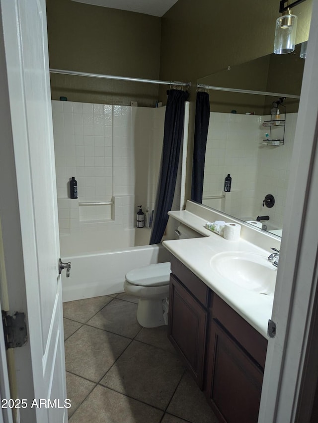 full bathroom featuring vanity, toilet, tile patterned flooring, and shower / bath combo