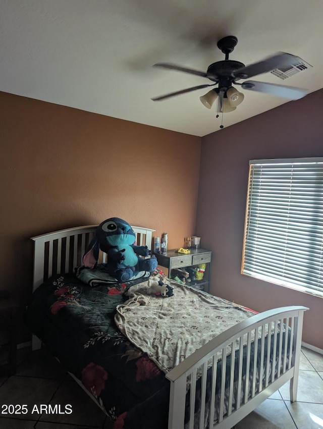 bedroom featuring light tile patterned floors, vaulted ceiling, and ceiling fan