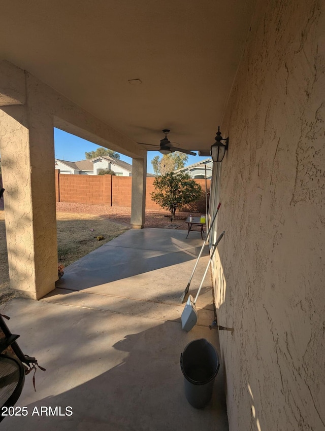 view of patio featuring ceiling fan