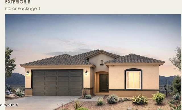 mediterranean / spanish-style home featuring a garage, concrete driveway, a tiled roof, and stucco siding