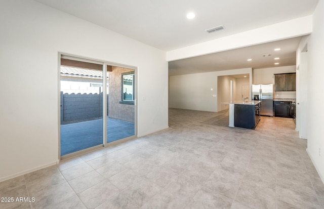 interior space featuring baseboards, visible vents, and recessed lighting