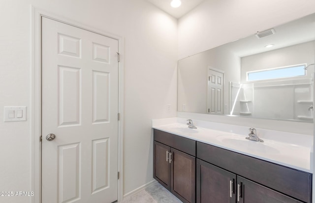 full bath featuring recessed lighting, visible vents, a sink, and double vanity