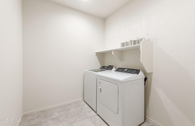 laundry room with laundry area, independent washer and dryer, and baseboards