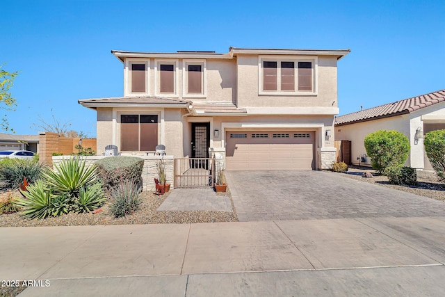 20846 E Longwood Dr, Queen Creek, AZ 85142 - prairie-style home featuring an attached garage, a fenced front yard, stucco siding, driveway, and a gate