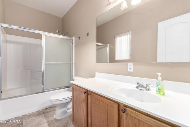 full bathroom featuring toilet, vanity, and combined bath / shower with glass door