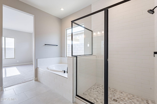 bathroom with plus walk in shower and tile patterned floors