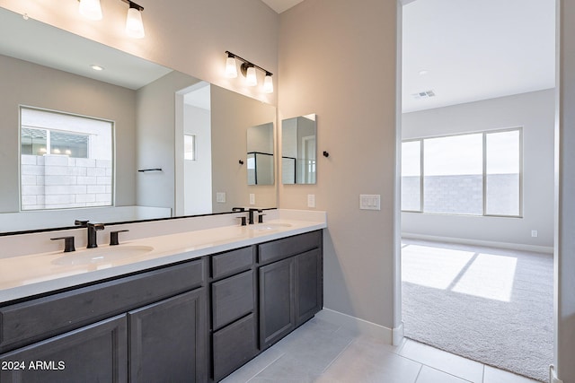 bathroom featuring tile patterned flooring and vanity