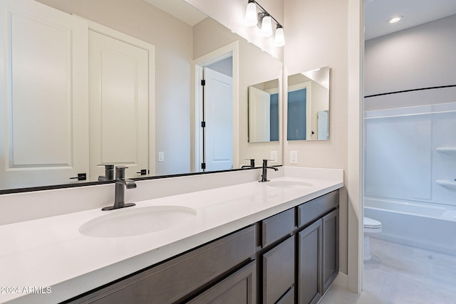 full bathroom featuring tile patterned floors, vanity, toilet, and tub / shower combination