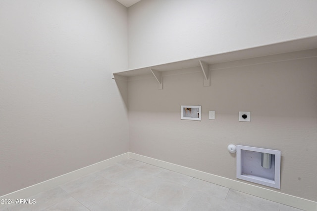 laundry area featuring washer hookup, electric dryer hookup, gas dryer hookup, and light tile patterned floors