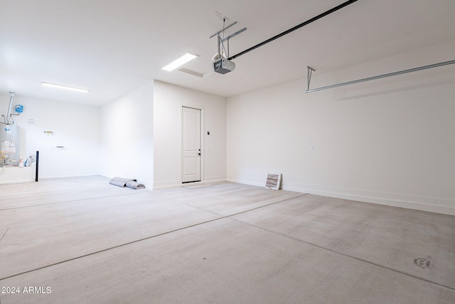 garage featuring a garage door opener and gas water heater