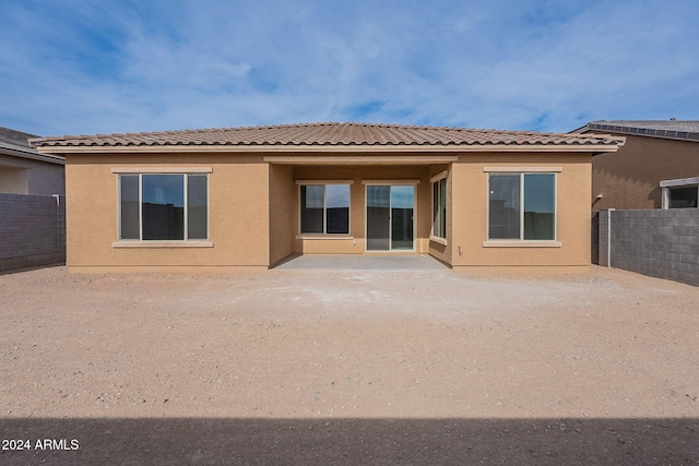 rear view of house featuring a patio