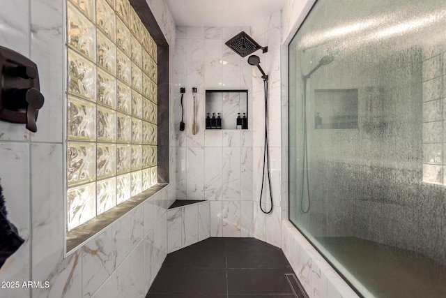 full bath featuring a tile shower